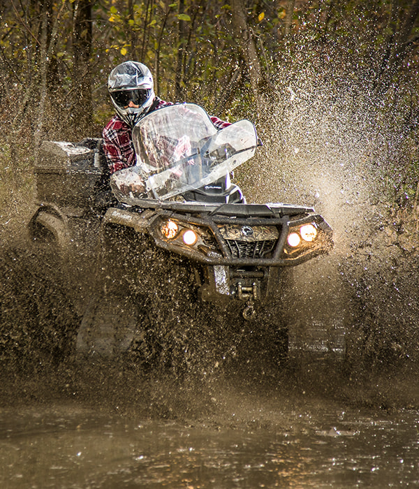 Rider on an ATV equipped with a WS4 track kit